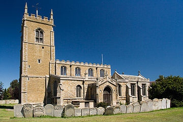 St Andrews behind the gaptoothed graveyard.