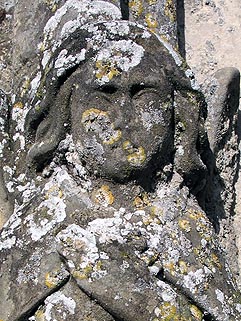 a worn angel on the porch