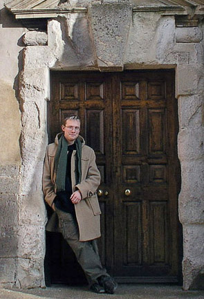 Ben in the doorway of Conington church